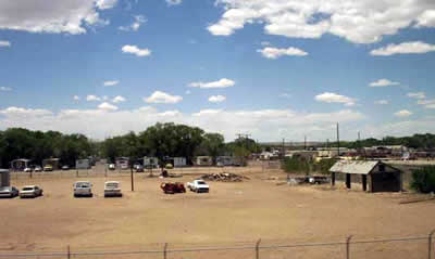 cars and dust along the train tracks