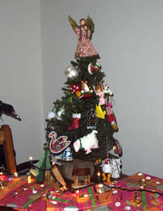 the tree, with lights and presents